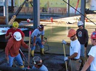 Independence Excavating employees working on the concrete flooring for the melt shop Independence Excavating employees working on the concrete flooring for the melt shop